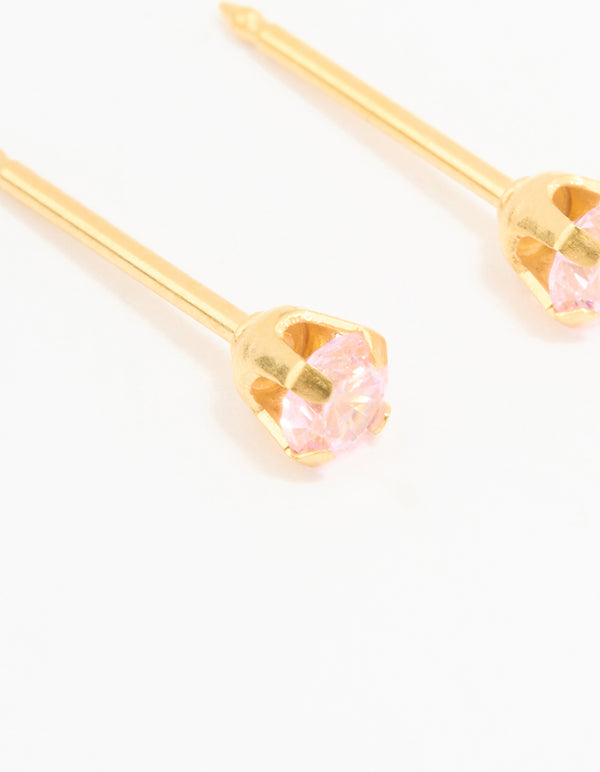 Highlighting 24K gold plated surgical steel 3MM pink cubic zirconia piercing studs close up view