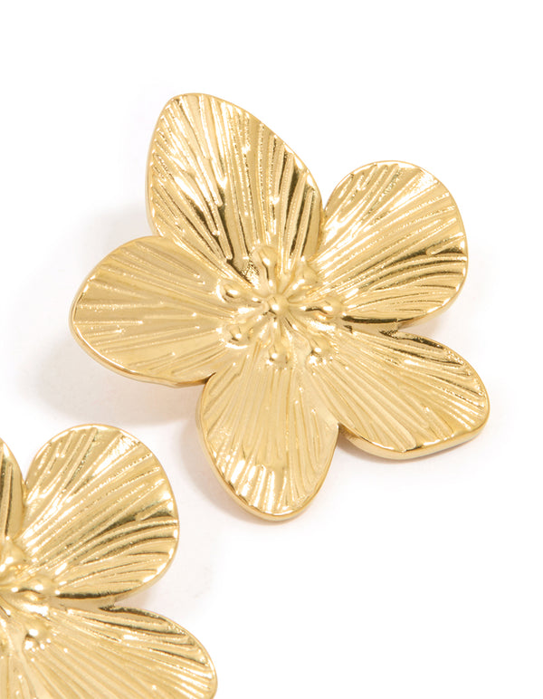 Highlighting waterproof gold plated stainless steel textured flower stud earrings with intricate floral detailing post detail view