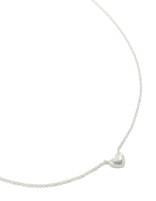 Crafted from sterling silver mini puffy heart charm pendant necklace in dainty style close up view