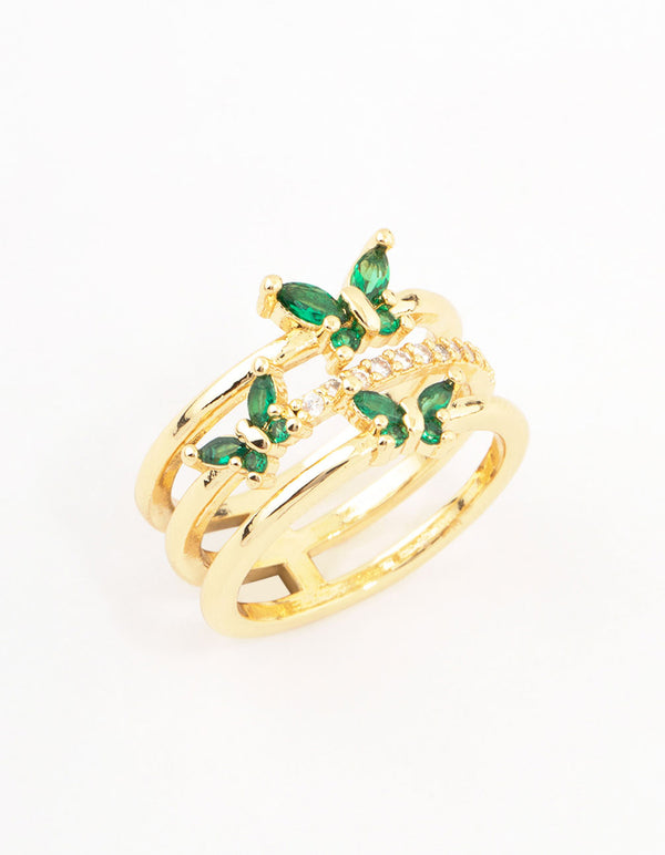 Elegant triple butterfly band ring in plated material featuring emerald cut stones with green and clear accents close up view