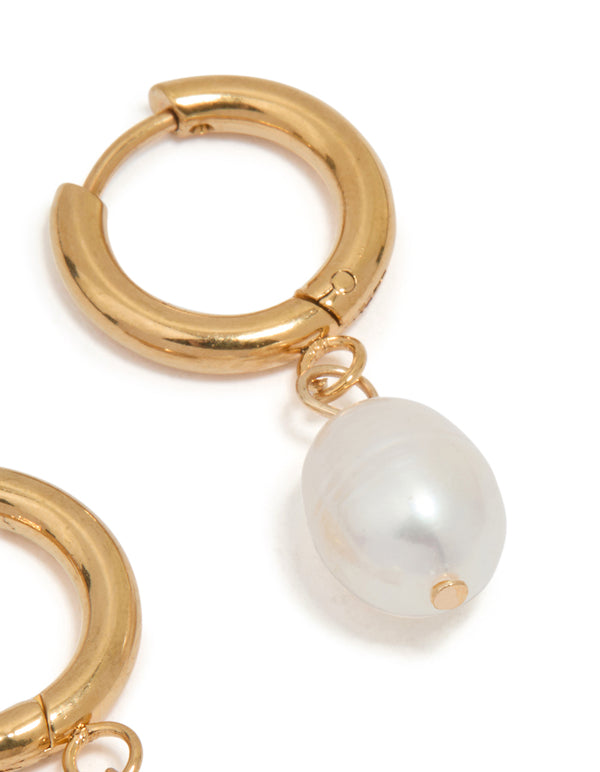 Designed with waterproof gold plated stainless steel freshwater pearl drop huggie earrings in white post detail view