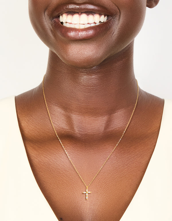 Elegantly designed gold plated sterling silver cubic zirconia cross necklace on neck view