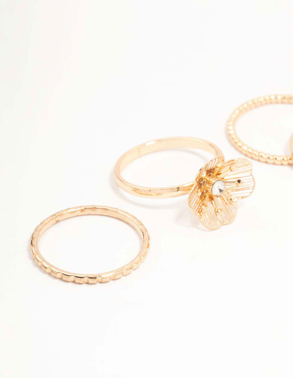 Showcasing gold diamante wire flower rings in a dainty 4-pack close up view