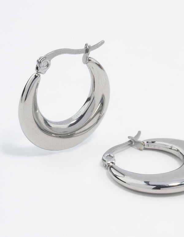 Highlighting waterproof flat crescent hoop earrings crafted from stainless steel in silver close up view