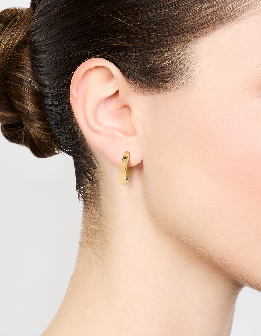 Featuring waterproof gold plated stainless steel basic clicker hoop earrings on ear view