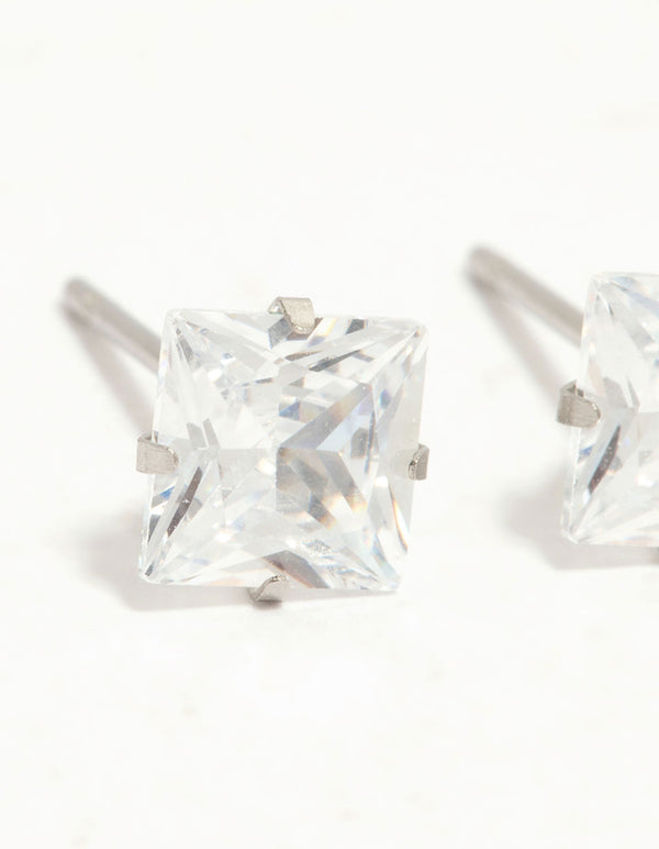 Admire waterproof diamante stainless steel stud earrings crafted with princess cut stones in silver and clear close up view