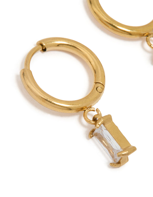 Highlighting waterproof gold plated stainless steel baguette diamante huggie earrings close up view