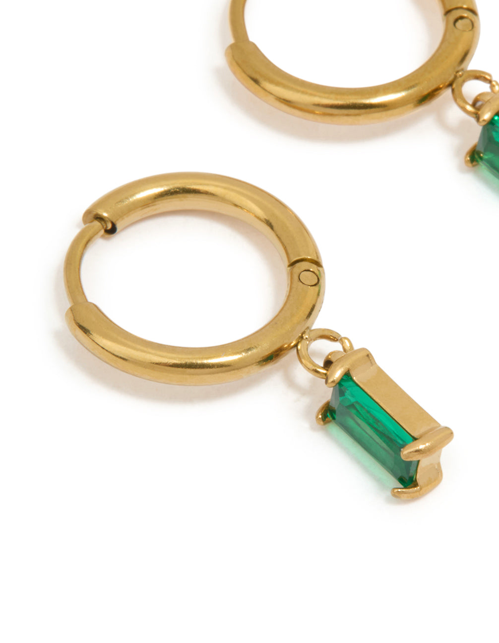 Featuring waterproof gold plated stainless steel huggie earrings with green baguette stone cut close up view
