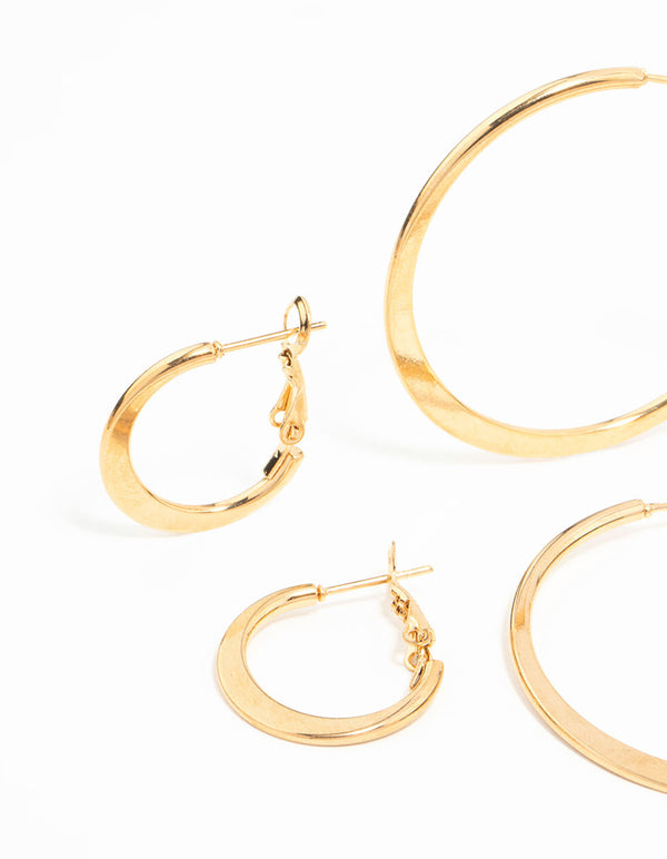 Detailed perspective of waterproof thin hoop earrings in gold plated stainless steel in a 3-pack showing closure mechanisms close up view