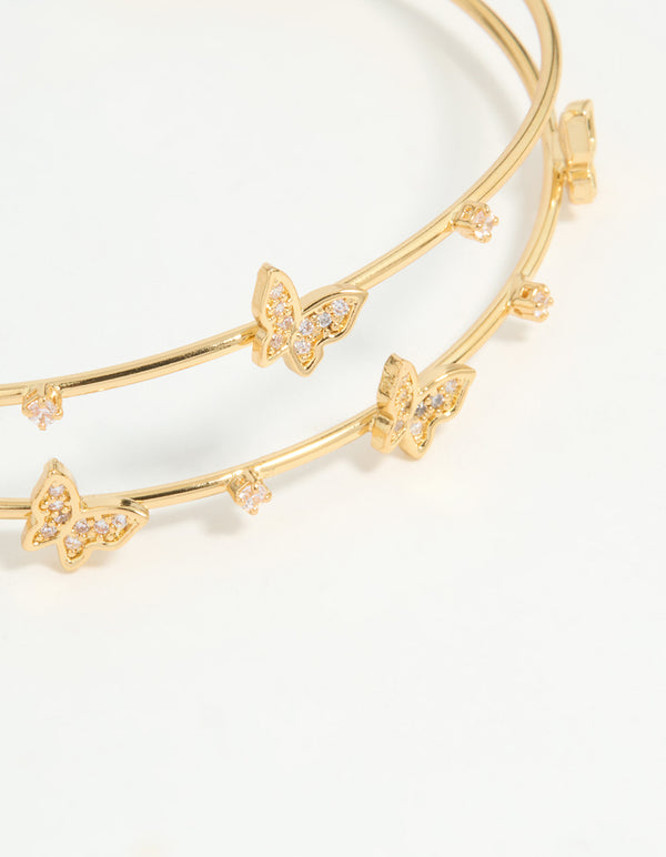 Presenting a gold plated mini butterfly wrist cuff close up view