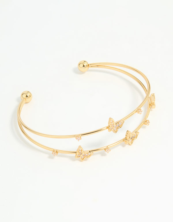 Showcasing a gold plated mini butterfly wrist cuff front view