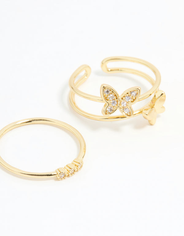 Elegant butterfly detailed rings with cubic zirconia crystals in gold plated finish, 3-pack close up view