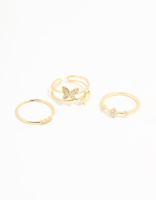 Showcasing butterfly feature rings crafted from gold plated metal with cubic zirconia crystal embellishments in a 3-pack front view