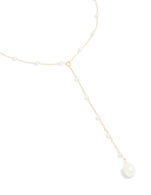 Showcasing waterproof gold plated stainless steel pearl Y-necklace with dainty design close up view