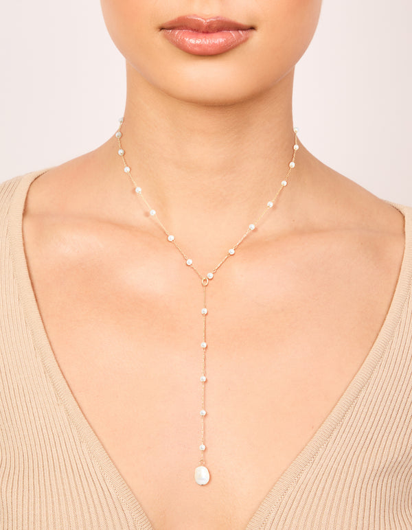 Delicate waterproof gold plated stainless steel pearl Y-necklace with dainty design on neck view