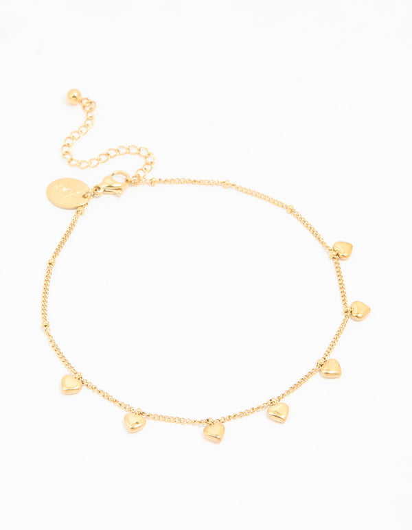 Crafted from waterproof gold plated stainless steel, this dainty anklet features heart charms with ball accents in gold front view