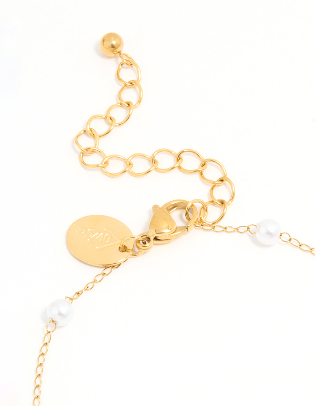 Showcasing a waterproof gold plated stainless steel anklet with charm ocean motif pearl and shell accents side view