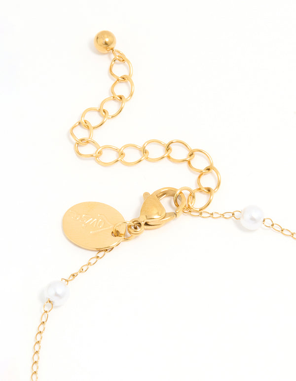Showcasing a waterproof gold plated stainless steel anklet with charm ocean motif pearl and shell accents side view