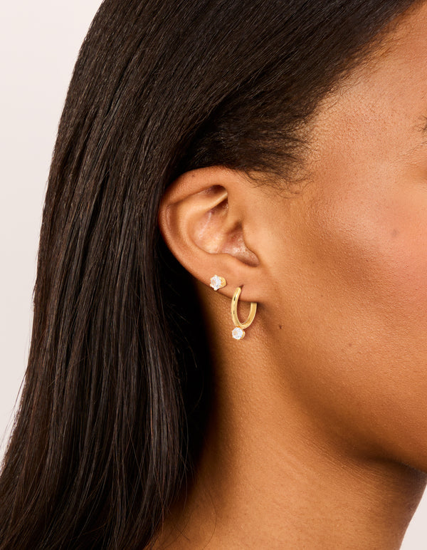 Showcase your style with dainty waterproof cubic zirconia stainless steel mini earrings in a 2-pack on ear view
