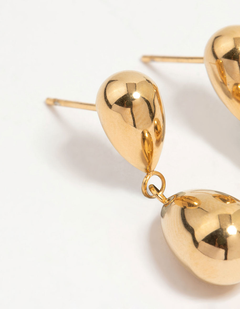 Designed with waterproof gold plated stainless steel double drop earrings in close up view