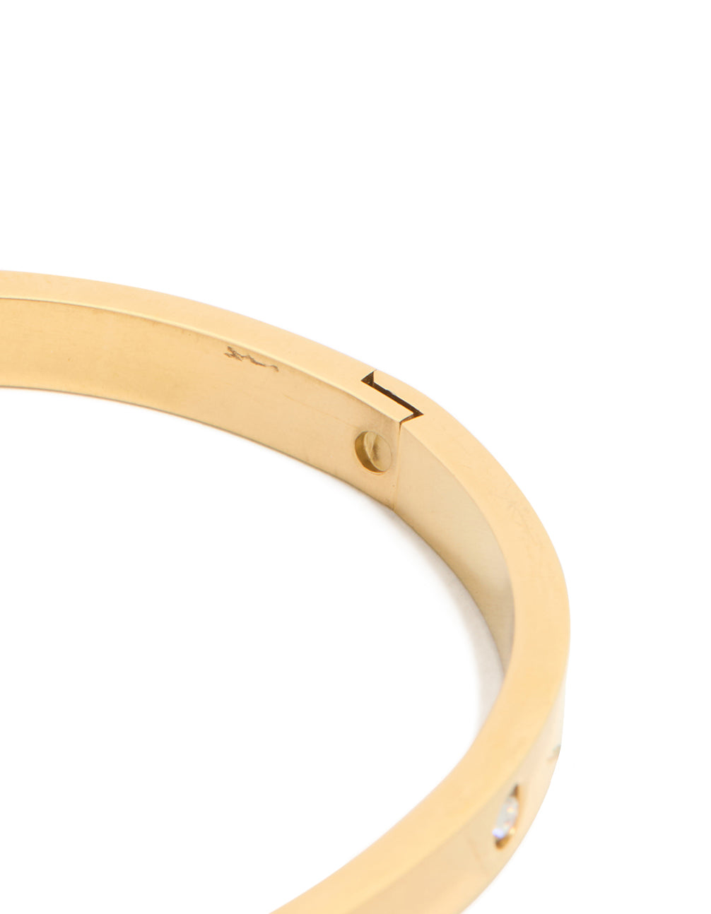 Highlighting the waterproof statement gold plated stainless steel diamante hinged bangle closure detail view