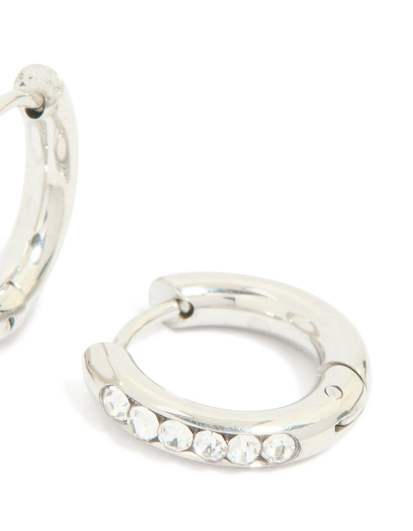 Crafted from waterproof stainless steel cubic zirconia round clicker huggie earrings with silver post detail view