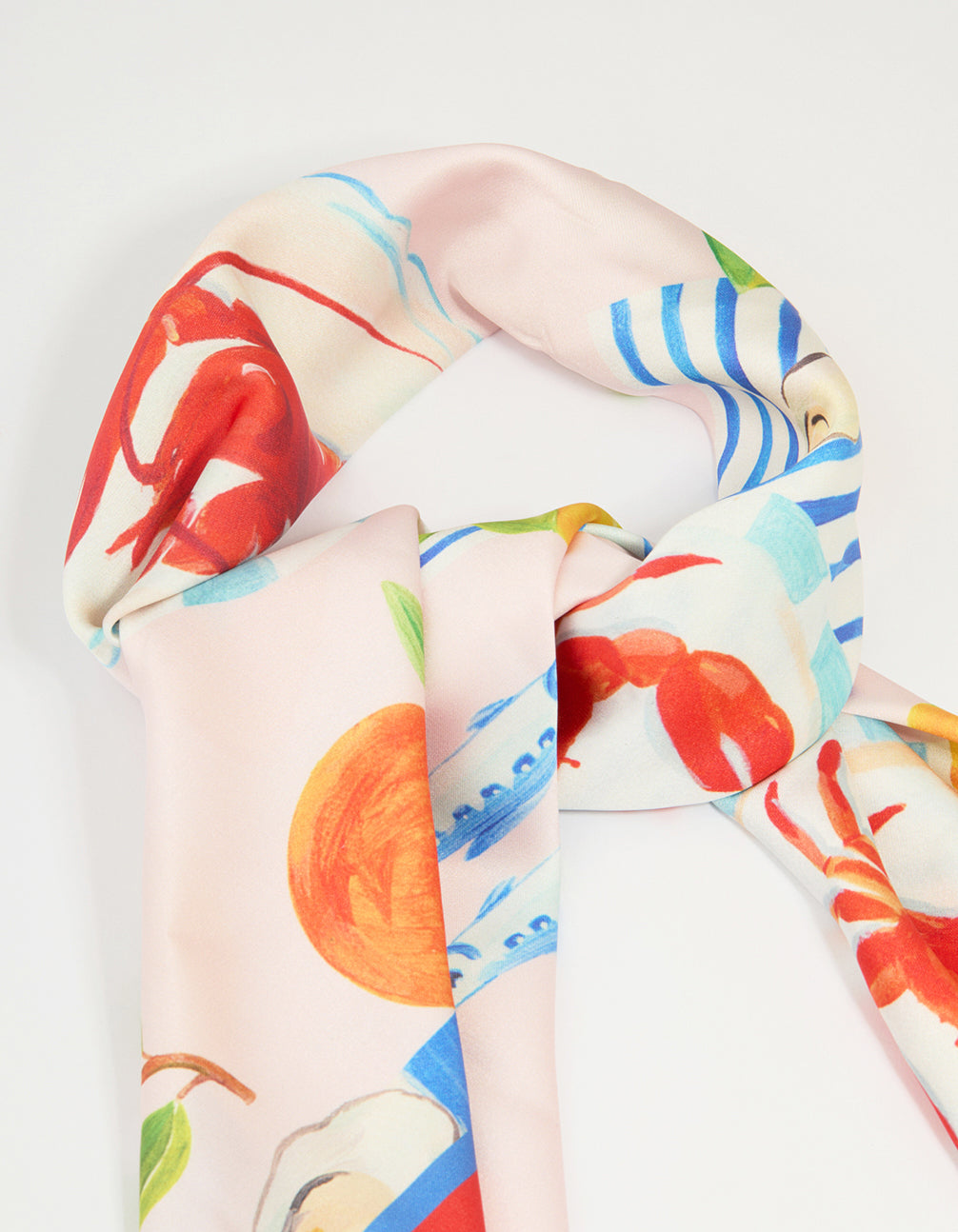 This charming summer fabric scarf with food, fruit, and ocean novelty print displays tomato, dodger blue, gold, and pale turquoise hues detail view