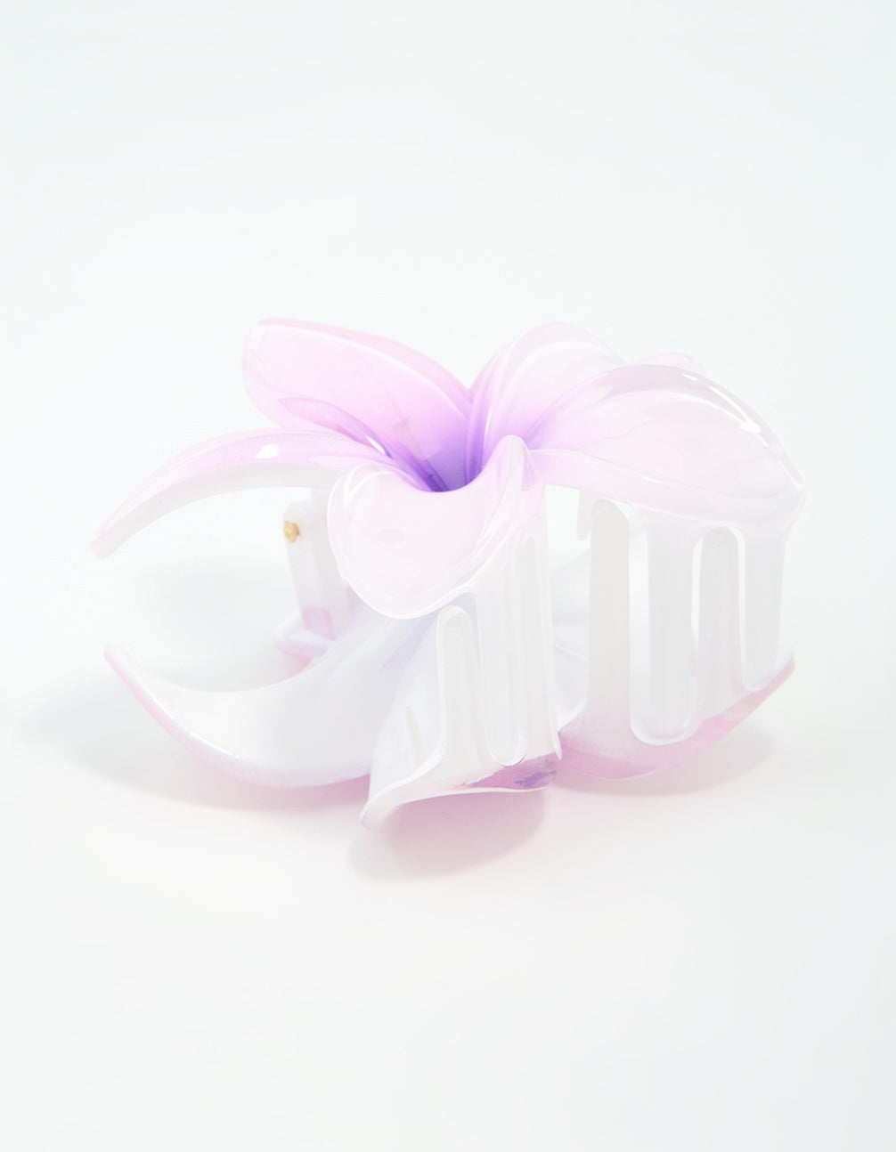Featuring a purple ombre pearlised frangipani claw clip in light pink, white, and gold side view