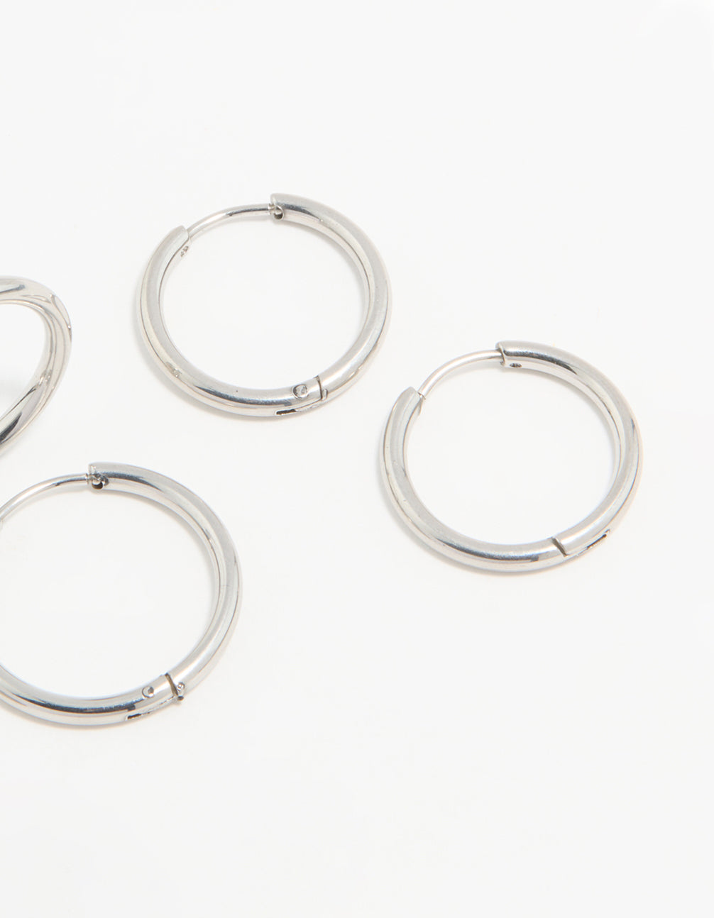 Presenting waterproof stainless steel thin hoop earrings in a 3-pack with silver finish post detail view