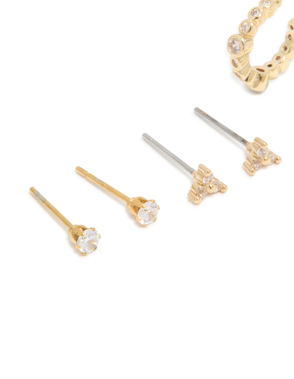 Featuring waterproof gold plated stainless steel diamante stud earrings in a 4-pack with huggie and stud closures close up view