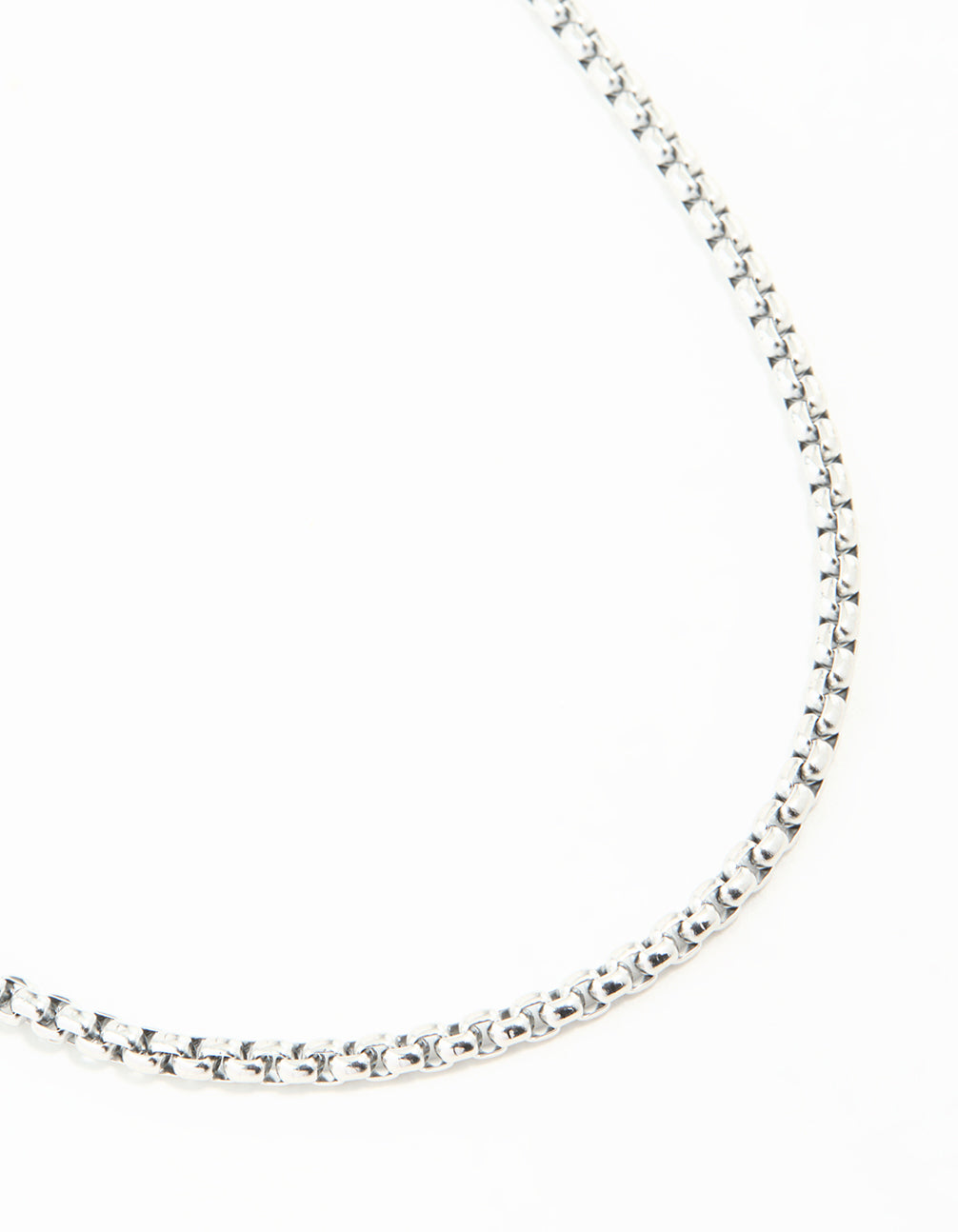 Showcasing a waterproof stainless steel round box chain short necklace in silver close up view