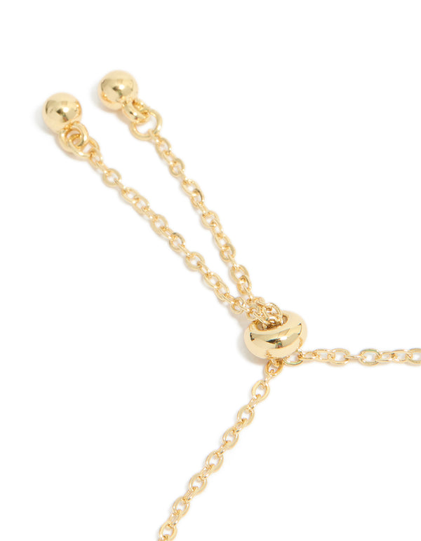 Highlighting gold plated cubic zirconia butterfly and heart toggle bracelet closure detail view