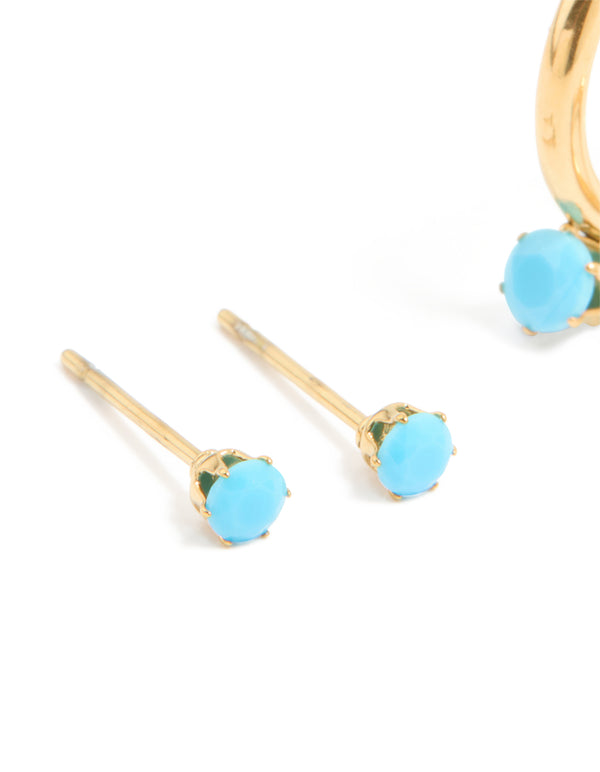 Showcasing dainty waterproof gold plated stainless steel turquoise mini huggie earrings in a 2-pack close up view
