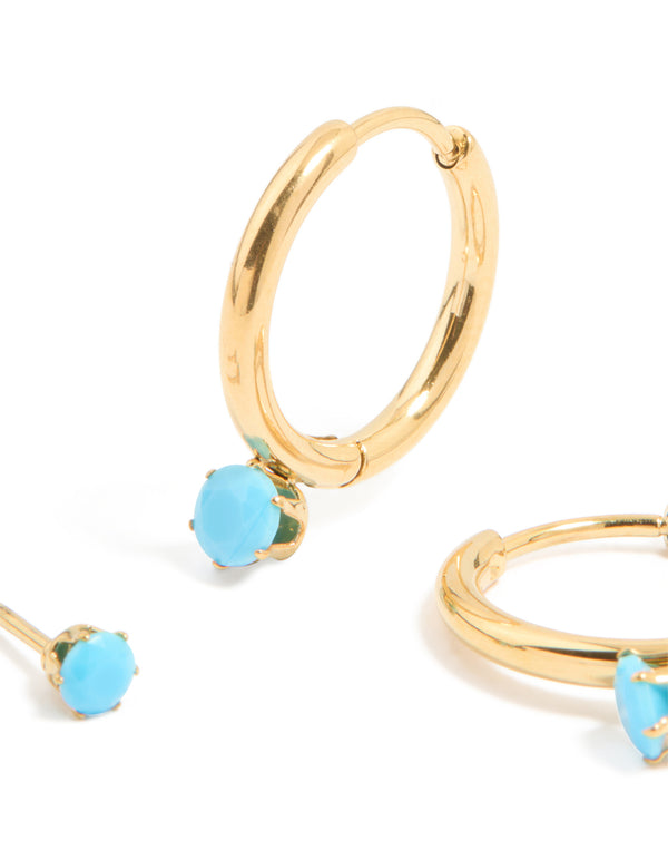 Featuring dainty waterproof gold plated stainless steel turquoise mini huggie earrings in a 2-pack post detail view