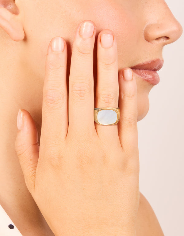 Showcasing a celestial waterproof gold plated stainless steel square semi precious moonstone signet ring with chunky design on finger view