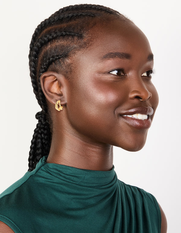 Showcasing waterproof gold plated stainless steel double row hoop earrings on model view