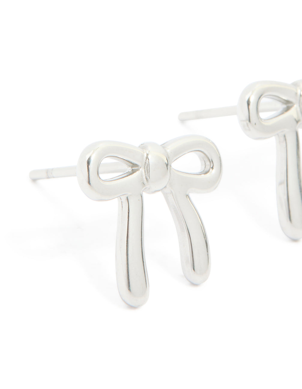 Crafted from waterproof stainless steel enamel bow earrings in silver close up view