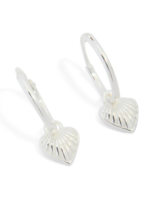 Crafted from sterling silver heart huggie earrings in silver front view