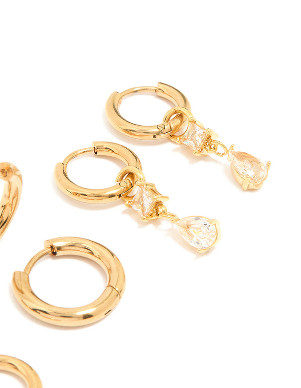 Displaying waterproof gold plated stainless steel cubic zirconia stud earrings in a 4-pack with huggie closure and crystal accents post detail view