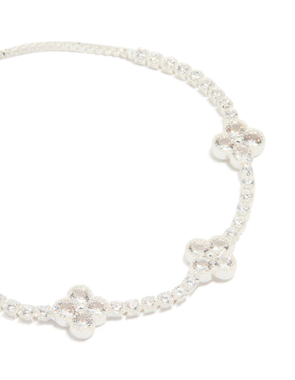 Crafted from silver plated cubic zirconia flower station toggle bracelet in dainty style close up view