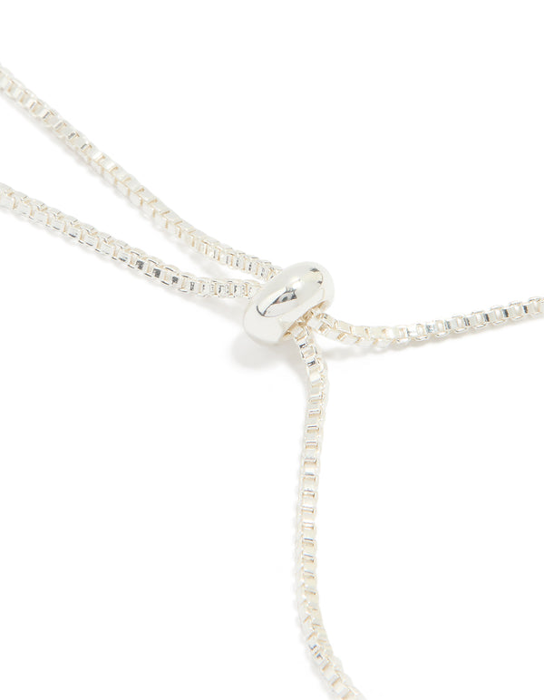 Designed with silver plated cubic zirconia flower station toggle bracelet in dainty style closure detail view