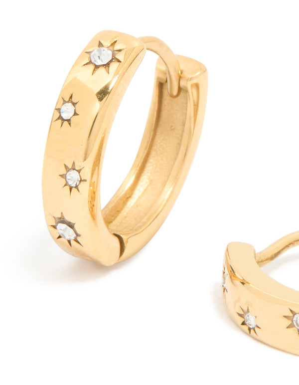 Featuring waterproof gold plated stainless steel diamante star clicker hoop earrings close up view