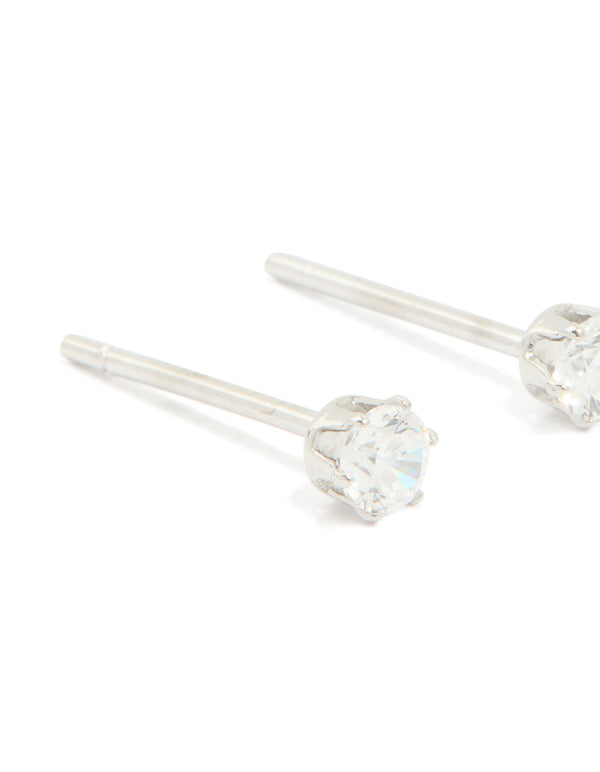 Featuring waterproof stainless steel cubic zirconia prism stud earrings in silver and clear close up view