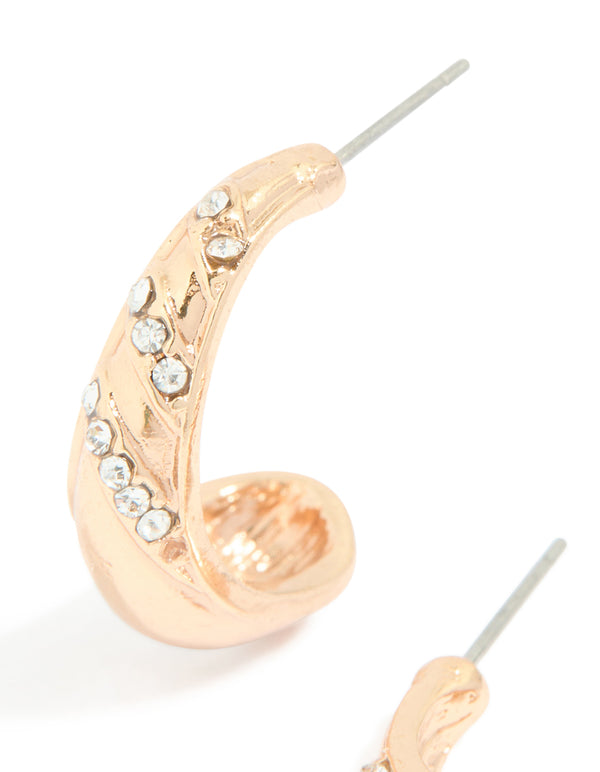 Stunning gold diamante pear open hoop earrings featuring white stone accents close up view