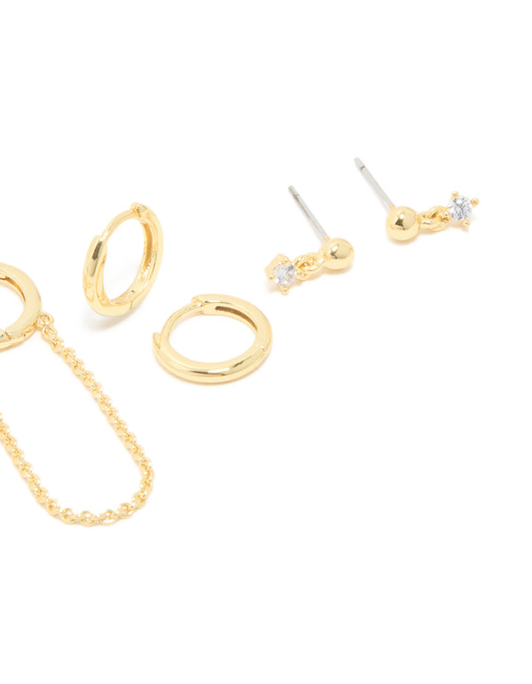 Beautifully crafted gold plated cubic zirconia flower studs and huggie earrings 4-pack with charm and floral features close up view