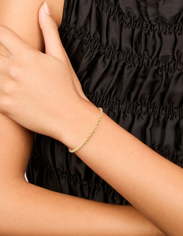 Featuring a waterproof gold plated stainless steel twisted chain bracelet on model view