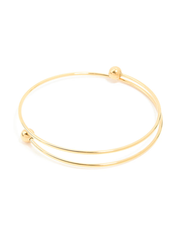 Showcasing a waterproof ball end bangle crafted from gold plated stainless steel front view