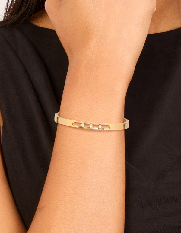Elegantly designed waterproof gold plated stainless steel diamante hinged bangle with white crystal detail on wrist view