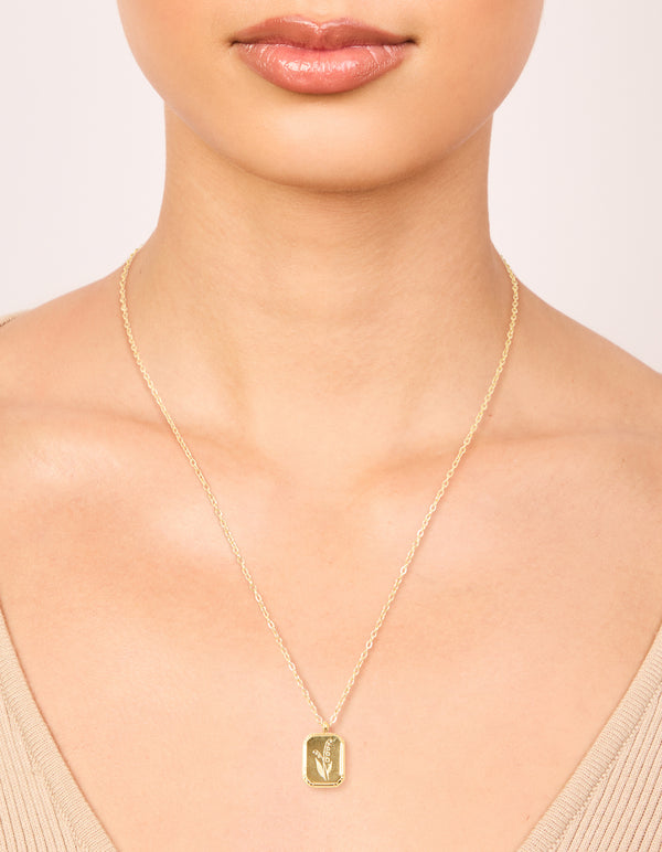 Featuring a waterproof birth flower May hawthorn necklace in gold plated stainless steel with floral detail on neck view