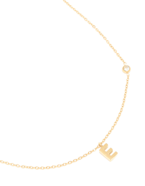 Beautifully crafted waterproof pendant necklace featuring letter E initial in gold plated stainless steel with dainty styling close up view